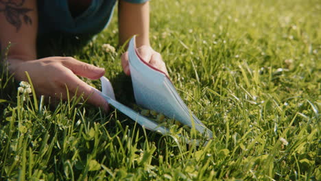 woman reading a book in a field of grass