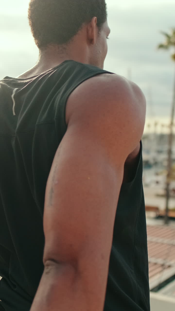 Young Black Man Warms Up His Wrists