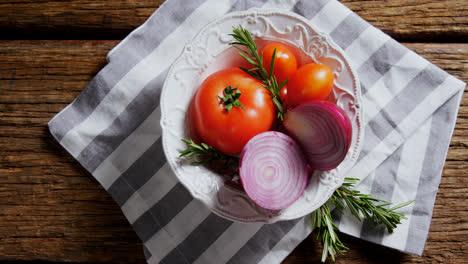 fresh onions, tomatoes and rosemary in bowl 4k