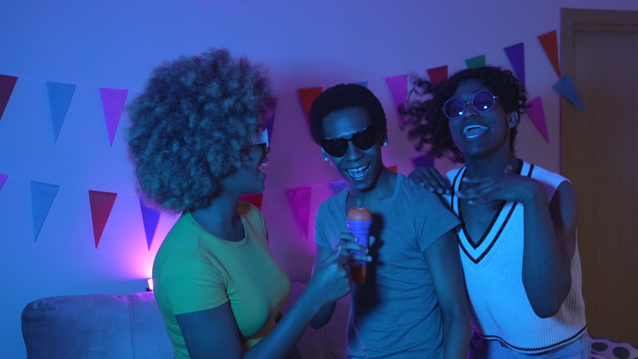 Group of friends partying and dancing together