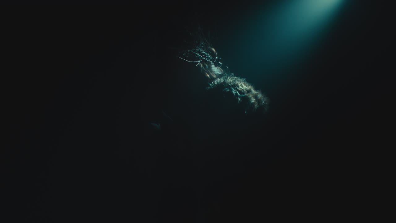 A creepy witch rises her head during the night storm