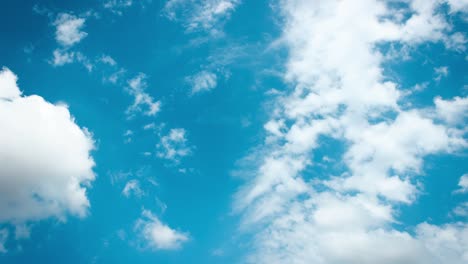 white clouds on light blue sky time lapse.