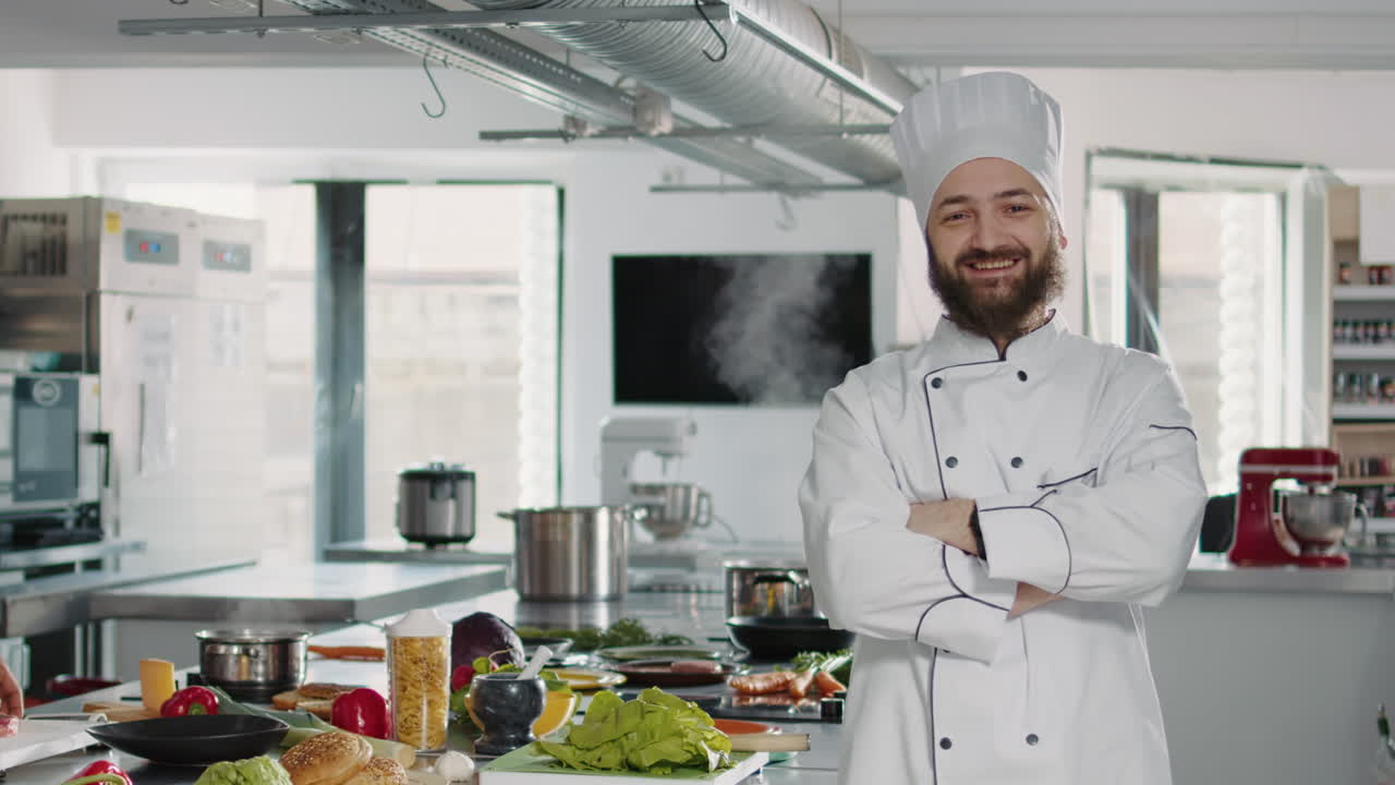 Portrait of male cook sitting in professional gastronomy kitchen
