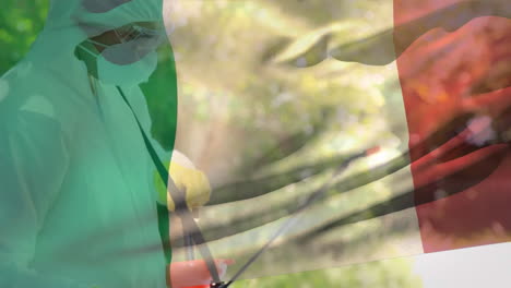 animación de la bandera italiana con un trabajador de la salud en el fondo durante la pandemia de coronavirus