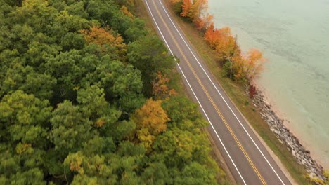 4k drone bikes and autumn colors with water