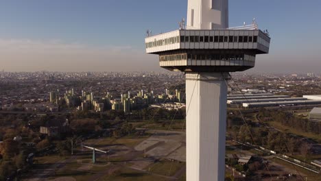 rising aerial footage of the top of the torre espacial in buenos aires in argentina