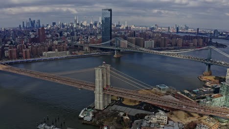 brooklyn bridge with manhattan and east river