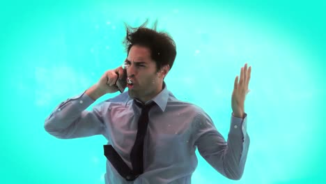 Angry-man-having-a-phone-call-underwater