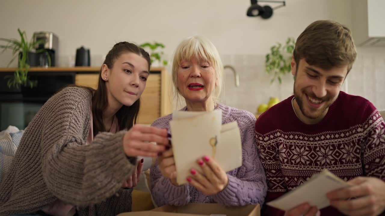 Family Reminiscing Over Old Photos