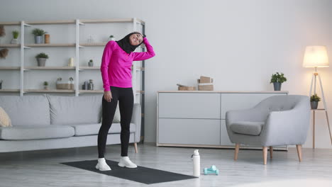 woman doing neck stretch exercise at home