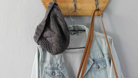 Denim-jacket,-purse,-and-woolly-hat-hanging-hook-4k