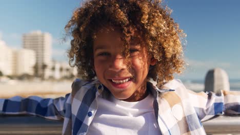 little boy smiling and looking at camera