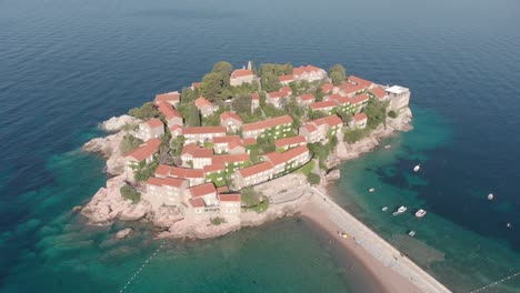 ariel footage of the famous hotel island called sevti stefan in montegro during a hot and sunny summers day