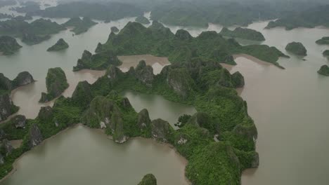aerial view of lush green limestone karst islands in a bay