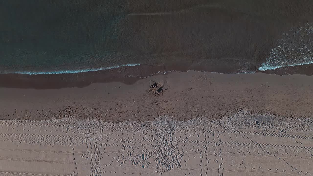 High angle view of beach coastline with panning to the right at 60fps