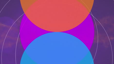 animación de círculos azules, rosados y amarillos que se mueven sobre un fondo violeta