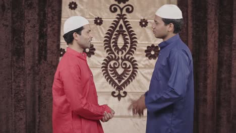 muslim friends talking to each other at home location