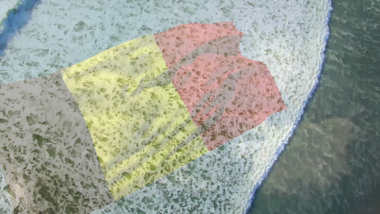 animación de la bandera de bélgica soplando sobre vista aérea de las olas en el mar