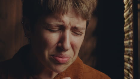 Young Regretful Woman Crying and Talking to Priest in Confession