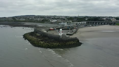 aerial 4k pan-flyover shot of lighthouse, balbriggan lighthouse