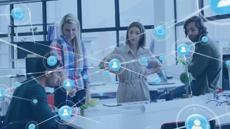 animation of media icons over diverse business people during meeting