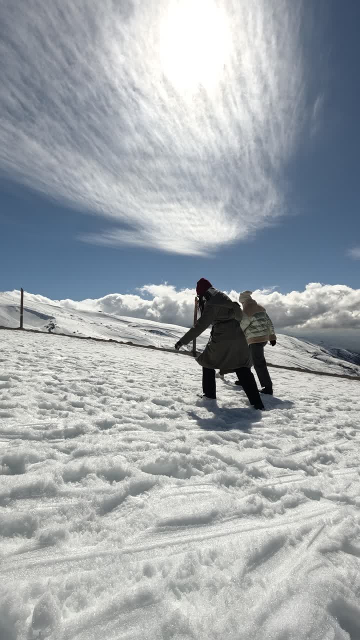 People enjoying a snowy mountain landscape