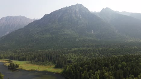 scenic mountainous landscape across seeley lake provincial park with beautiful forest trees from an aerial drone