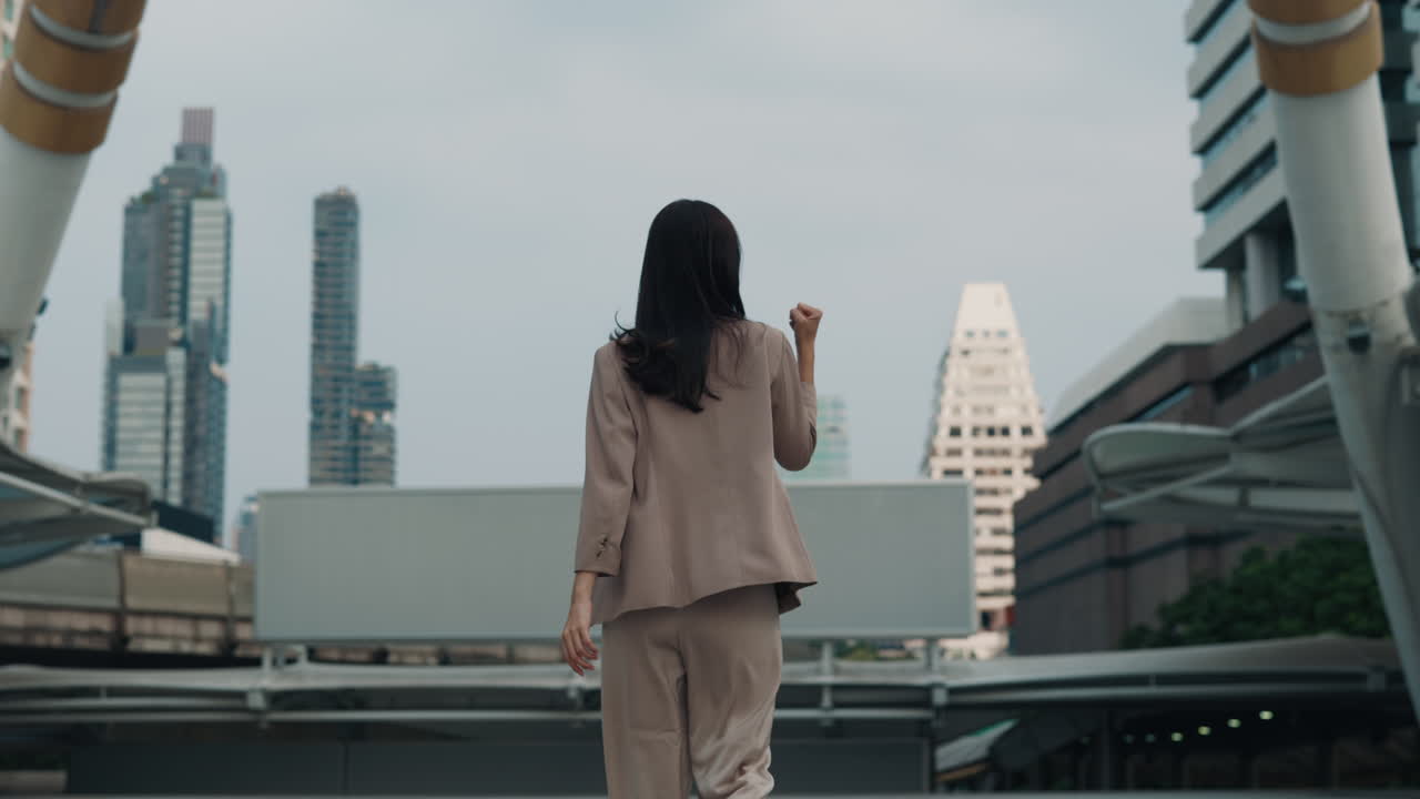 Businesswoman Celebrating Success in City