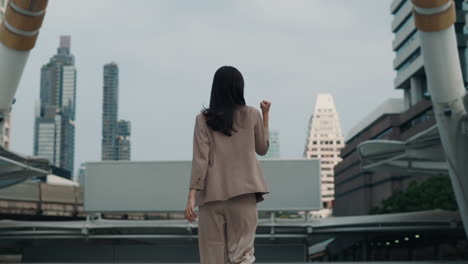 businesswoman celebrating success in city