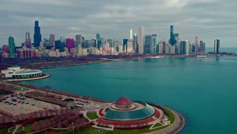 Dramatic Scenic view of Adler Planetarium with Chicago&#039;s skyline in the backdrop