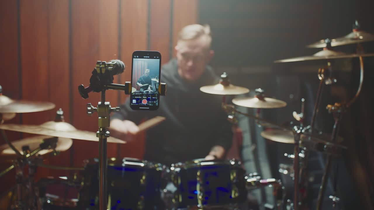 Drummer Recording a Drumming Session with a Smartphone