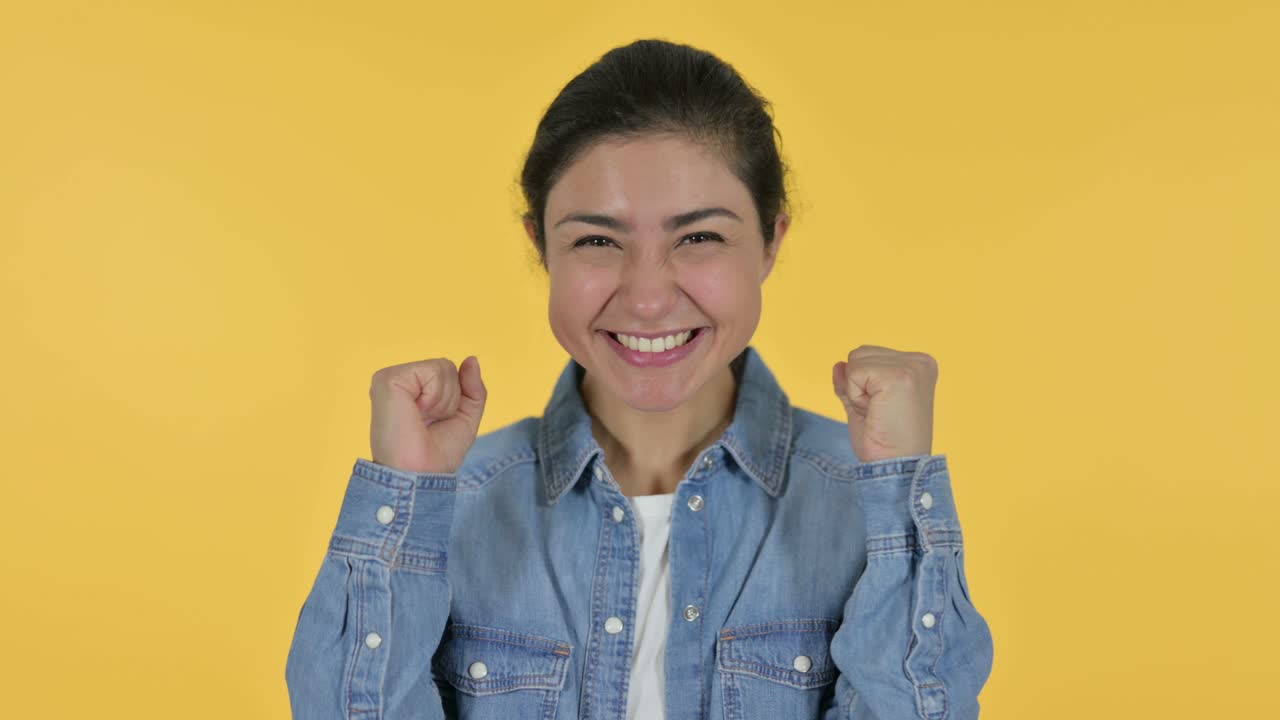 Excited Young Indian Woman Celebrating, Yellow Background