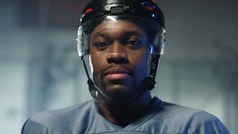 Close-Up-Of-A-Happy-Male-Hockey-Player-Looking-Cheerfully-At-The-Camera-And-Breathing-In-Cold-Air-On-The-Ice-Arena