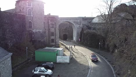 Car-driving-though-bridge-of-the-citadel-of-Namur,-Belgium