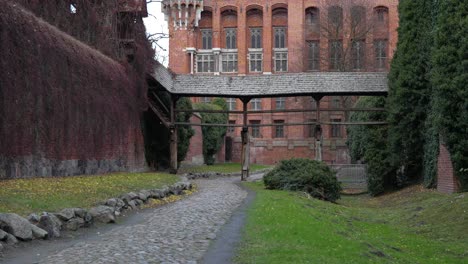 cobblestone path around world's largest castle. malbork fortress, famous landmark in poland