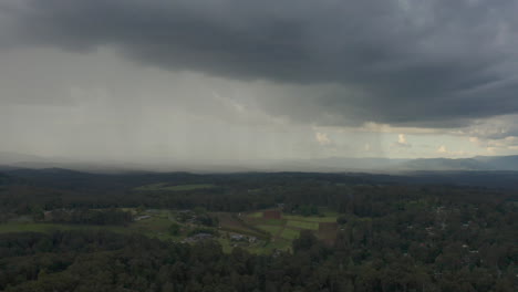 Camera-pans-right,-displaying-lush-landscape-under-dense-clouds