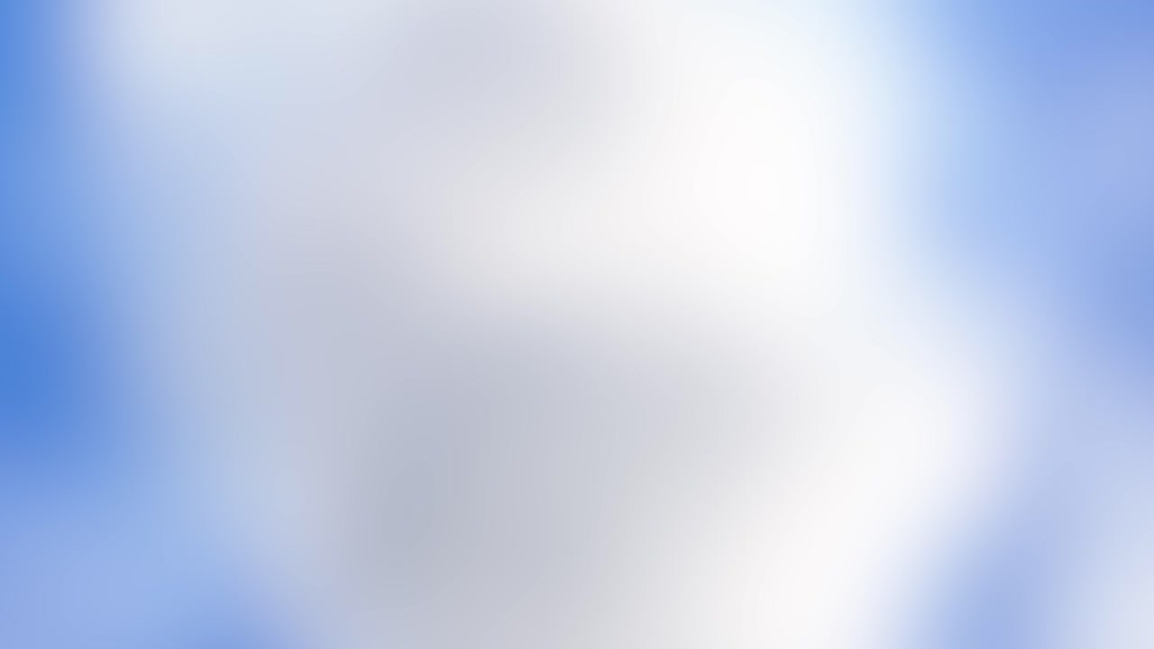 Blurred blue and white clouds create a soft, abstract background with gentle motion and a calming atmosphere