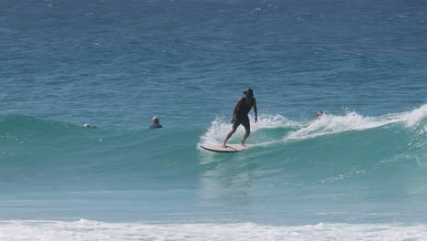 surfer catching and riding a wave successfully