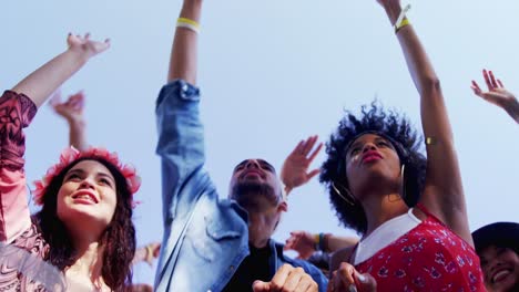 Group-of-friends-dancing-at-music-festival-4k