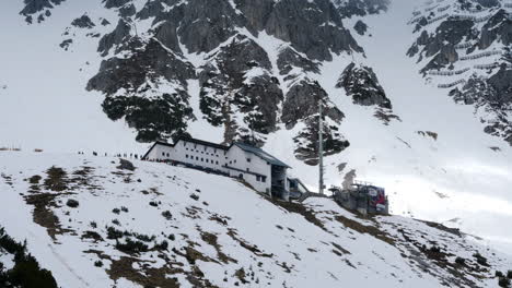 cable car station at the nordkette mountain on a partly sunny day in winter time