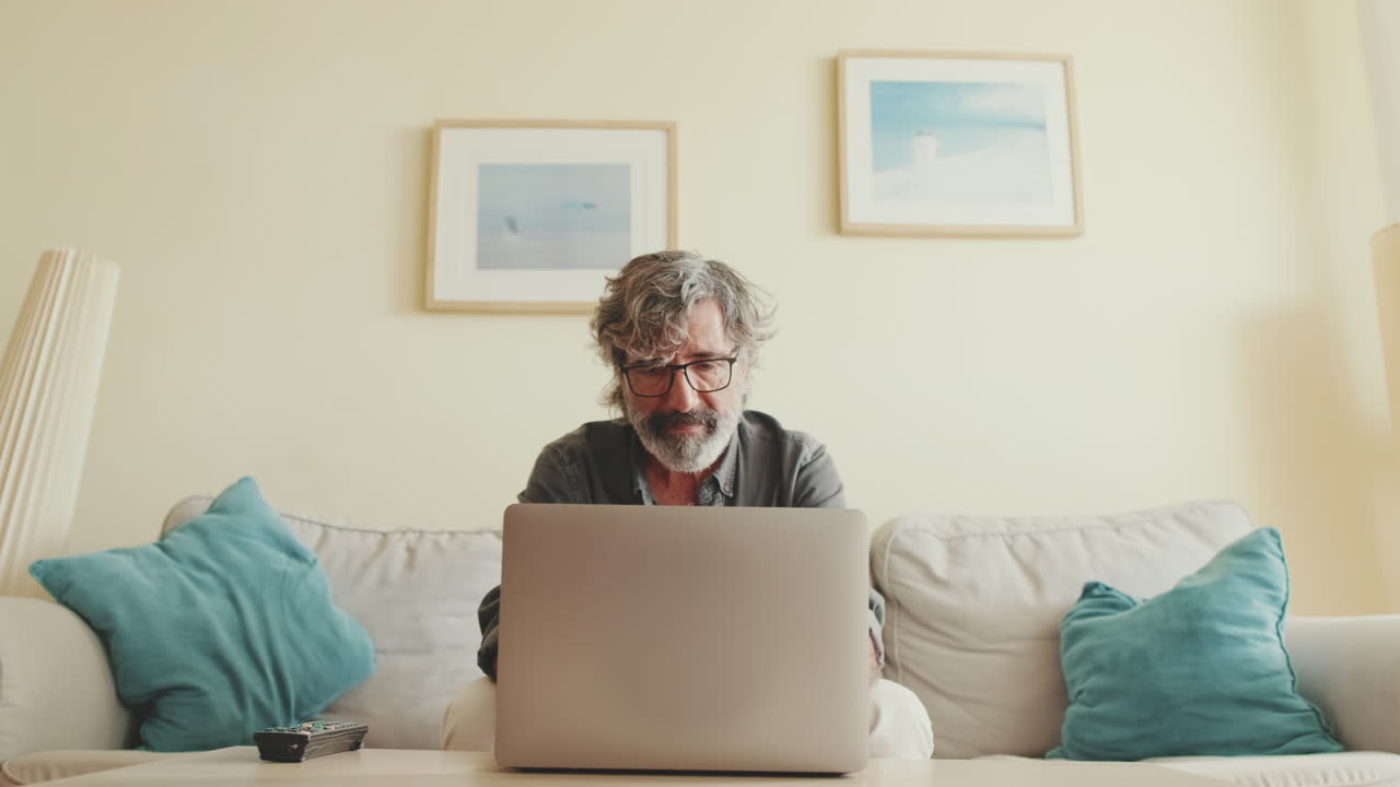 A man working on his laptop at home