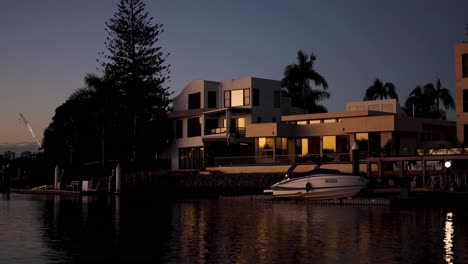 modern homes and boats at sunset