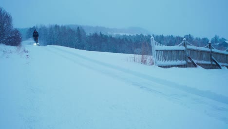 Man-Clearing-The-Pathway-Using-Snowblower-Or-Snow-Thrower---Wide-Shot