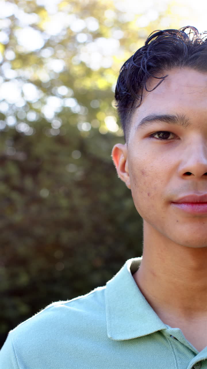Vertical video: Playing with blocks, child smiling and sitting on floor in living room