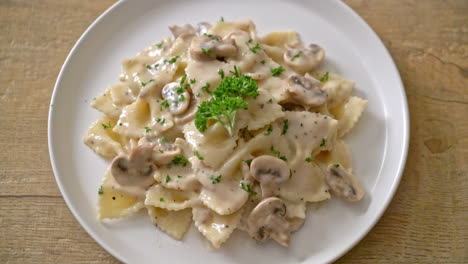 farfalle pasta with mushroom white cream sauce - italian food style