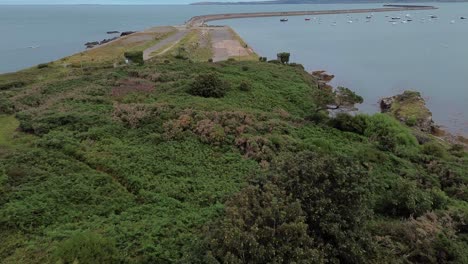 neglected soldiers point house remains aerial view flying towards holyhead coastal breakwater