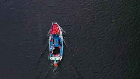 irish fishing boat sailing on a calm sea in ireland