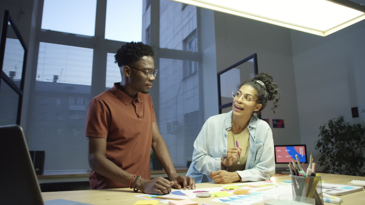 Colleagues Working in Office in Evening