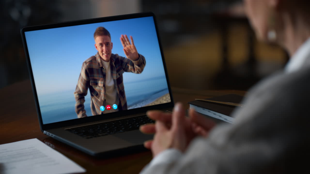 Woman communicating laptop video chat at evening apartment closeup. Lady talking