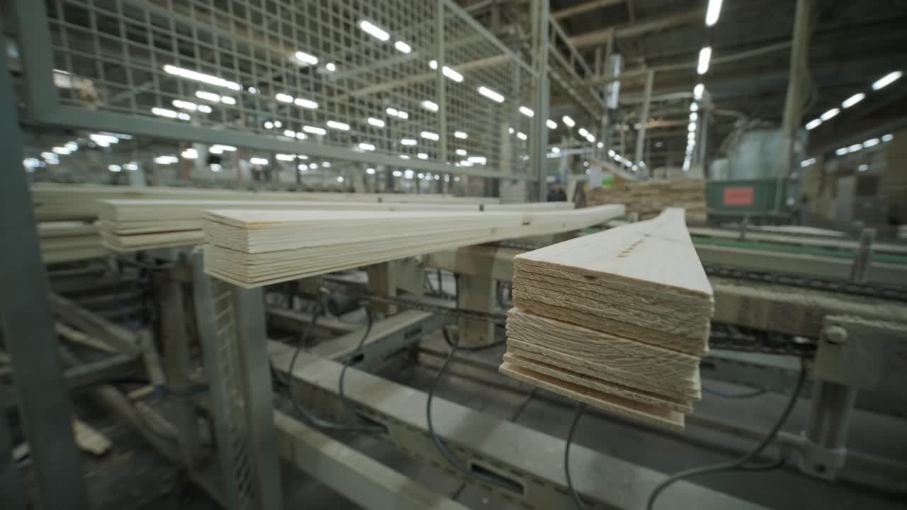 Wooden Planks Moving on a Conveyor Belt in a Factory